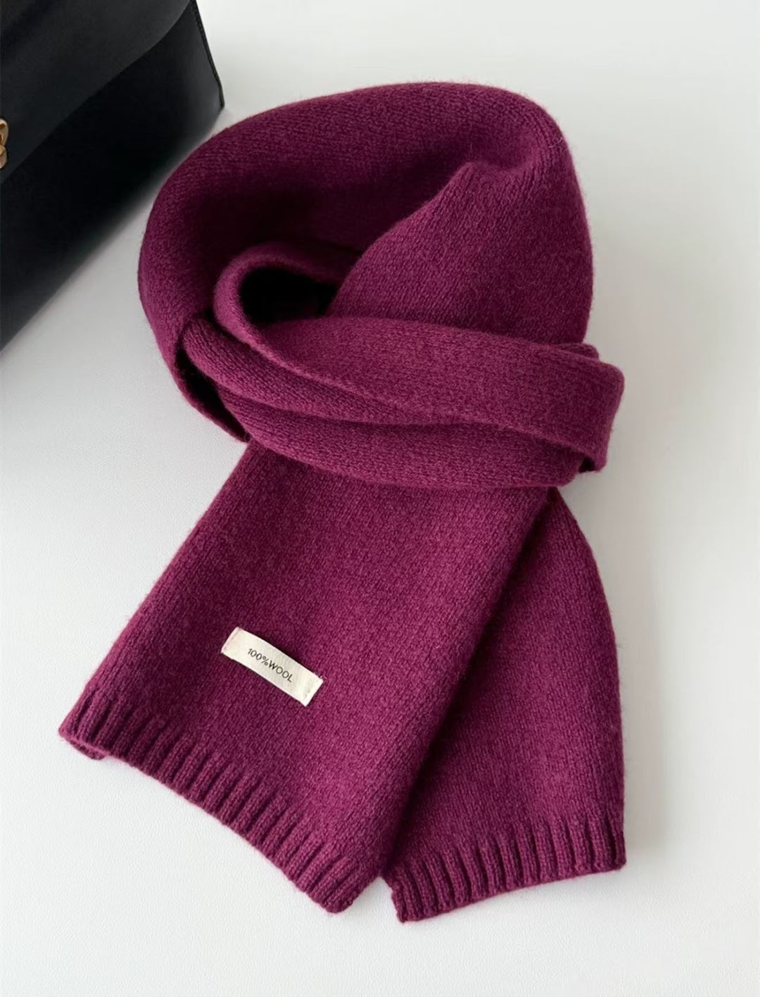 Simple knitted scarf made of pure wool