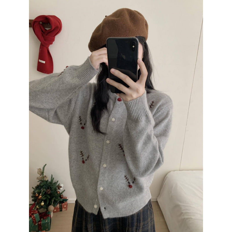 Festive knitted sweater with reindeer embroidery