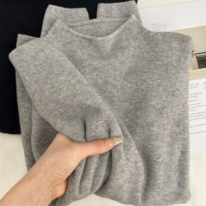 Slim women's knitted sweater with stand-up collar