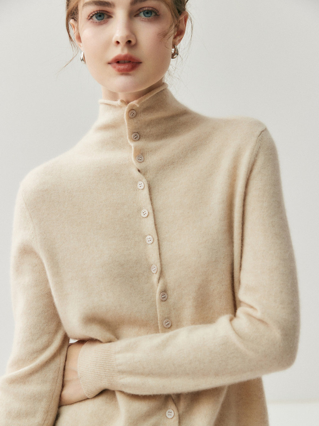 Women's cardigan with roll neck and button placket