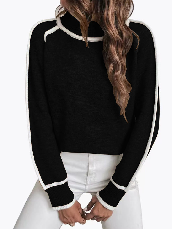 Loose women's knit sweater with high collar