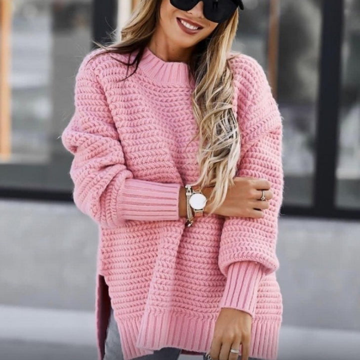 Loose women's knit sweater with cable pattern