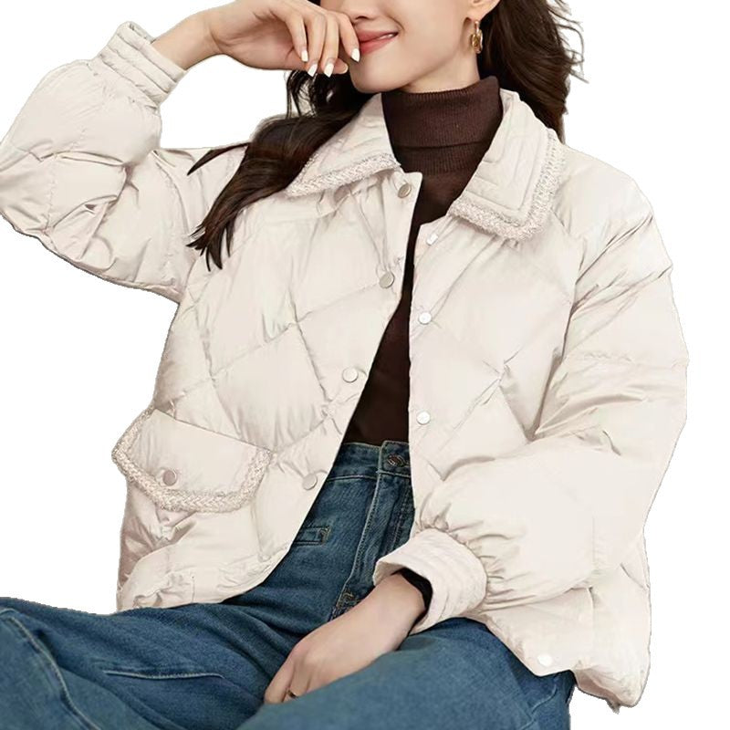Short women's quilted jacket in diamond design