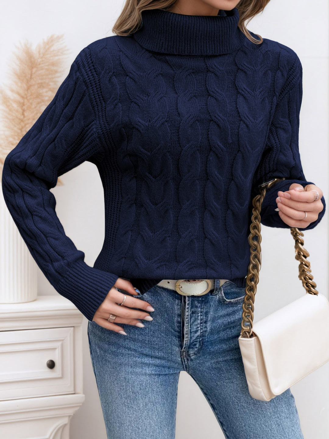 Knit sweater with cable pattern and high collar