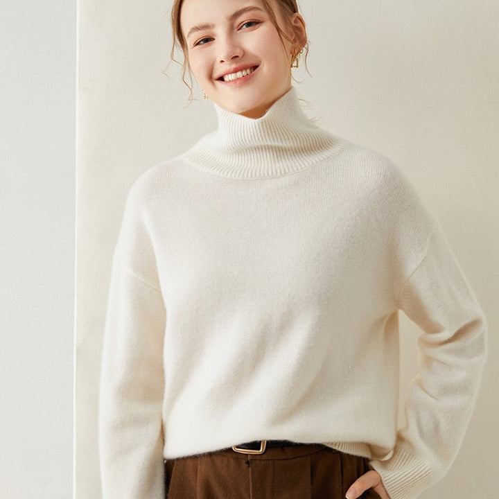 Loose women's knitted sweater with turtleneck