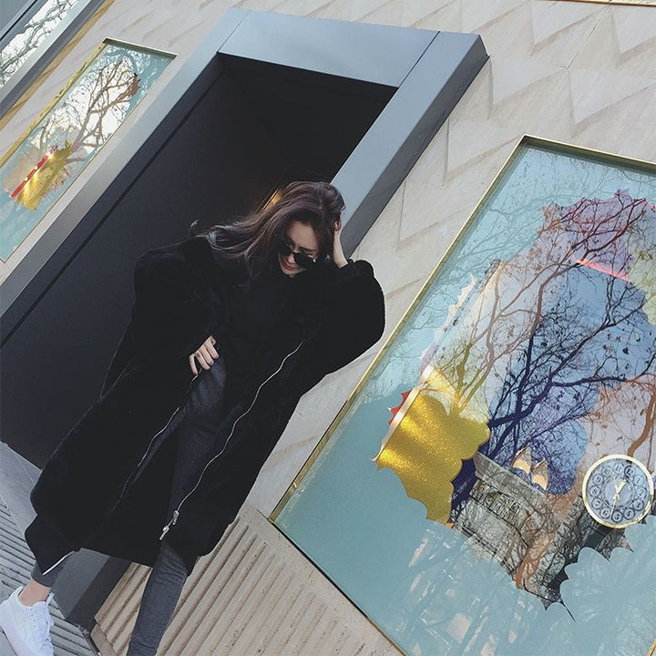 Long women's faux fur coat with hood