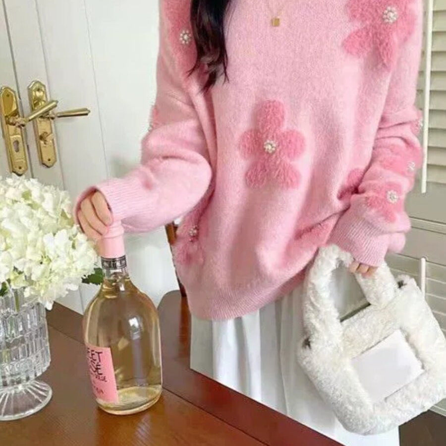 Women's knitted pullover with floral pattern and pearl trim