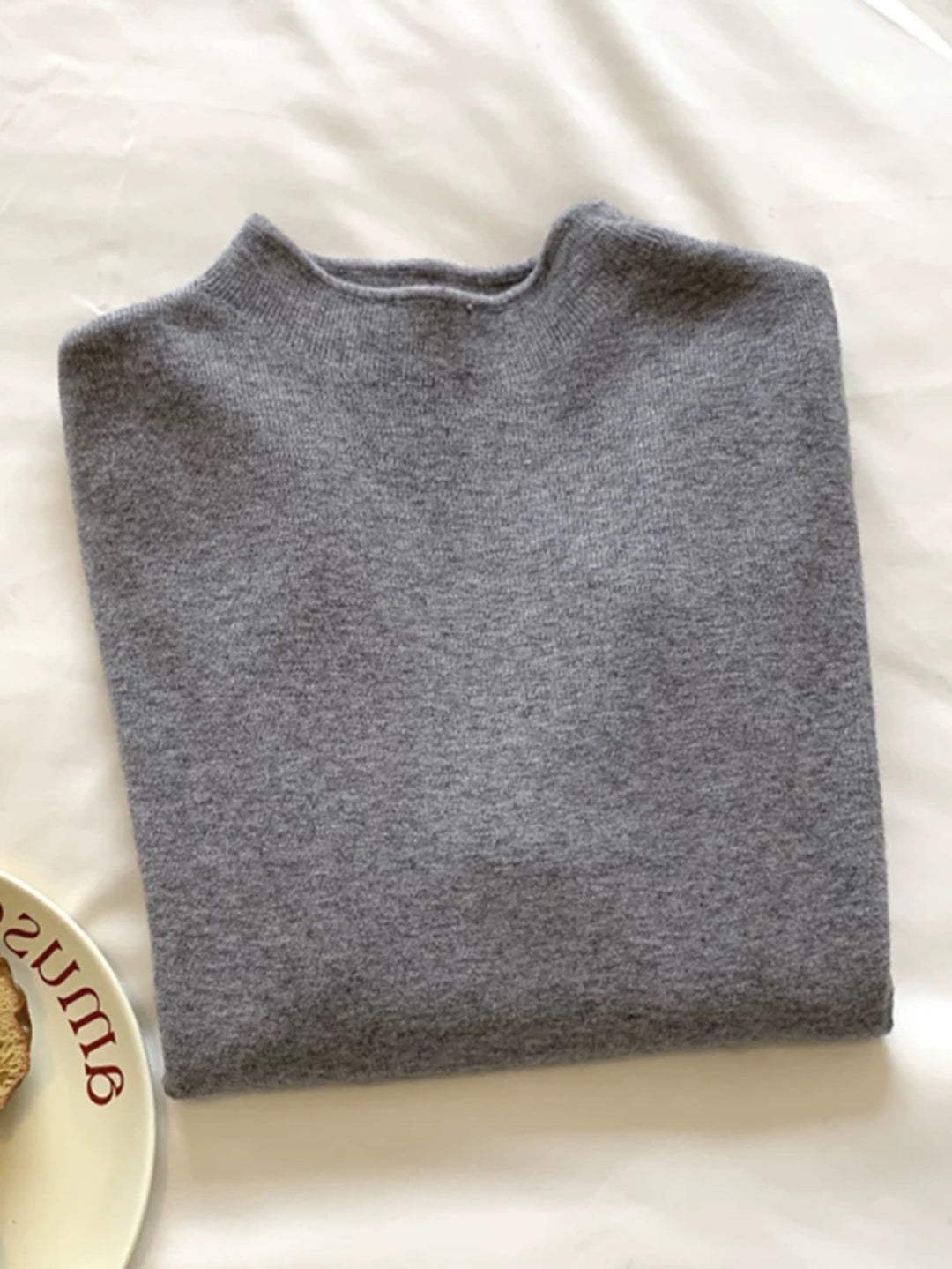 Slim women's knitted sweater with stand-up collar