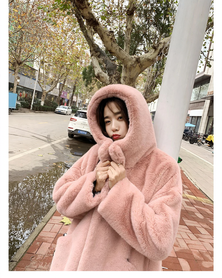 Long women's coat in faux fur with hood