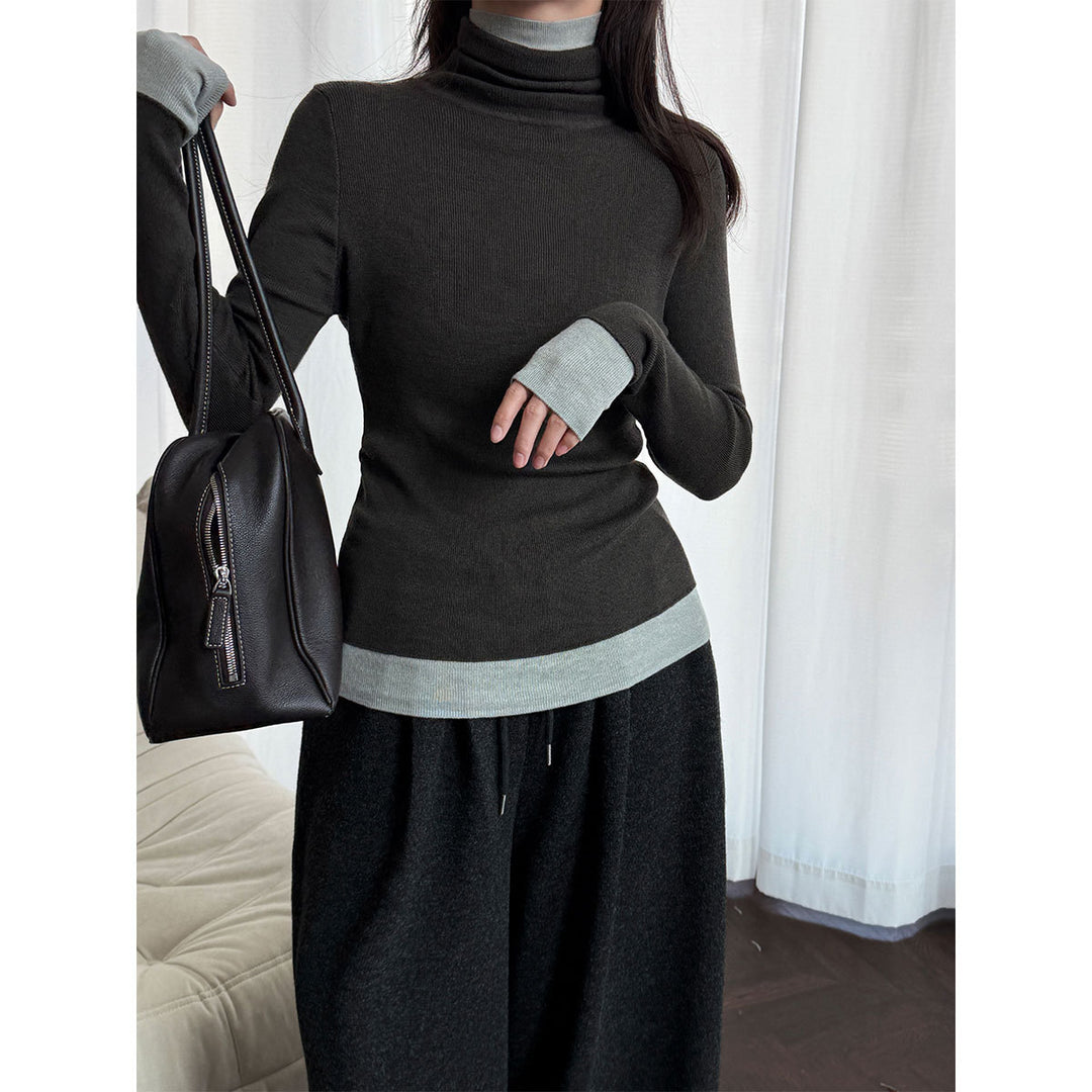 Women's knit pullover with stand-up collar and contrast details