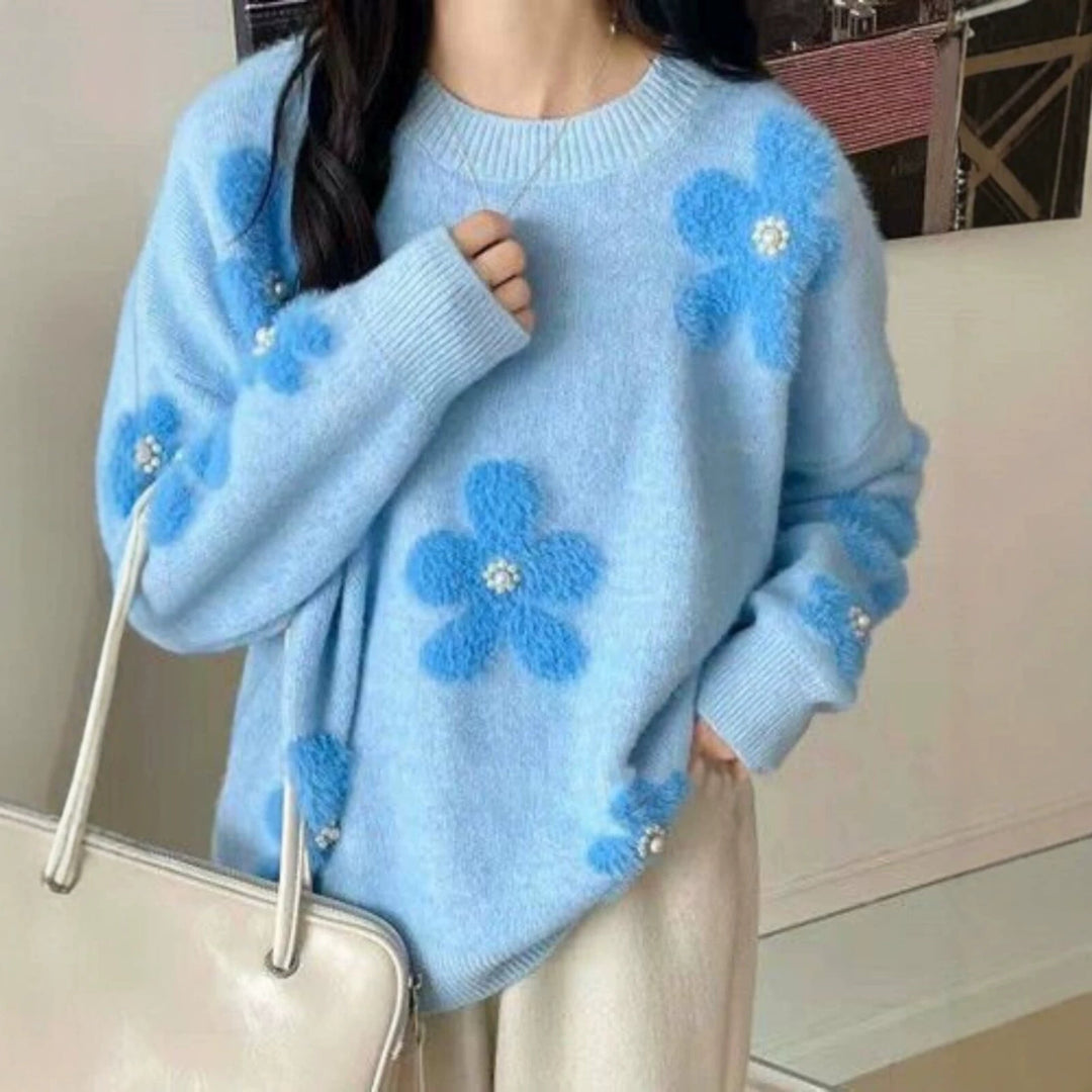 Women's knitted pullover with floral pattern and pearl trim