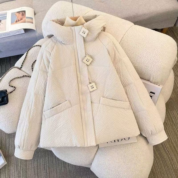 Short women's quilted jacket with hood, loose fit