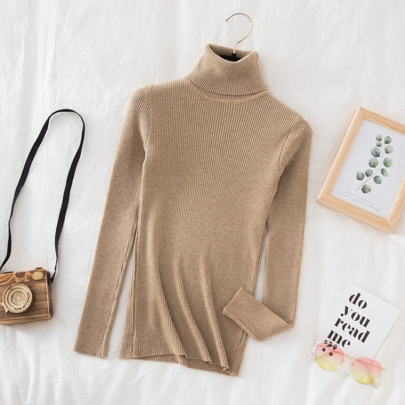 Women's knitted sweater with high collar, fitted