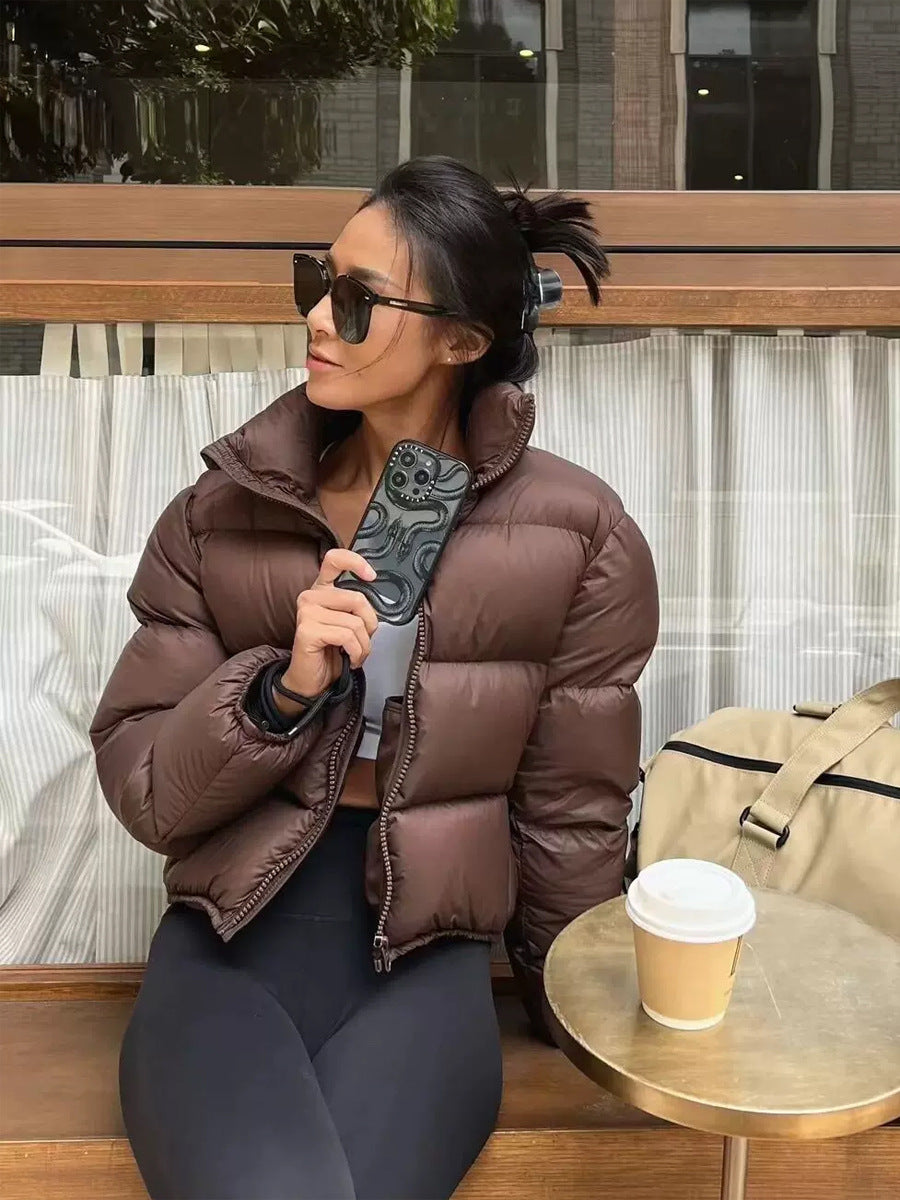 Short, padded women's winter jacket in puffer style