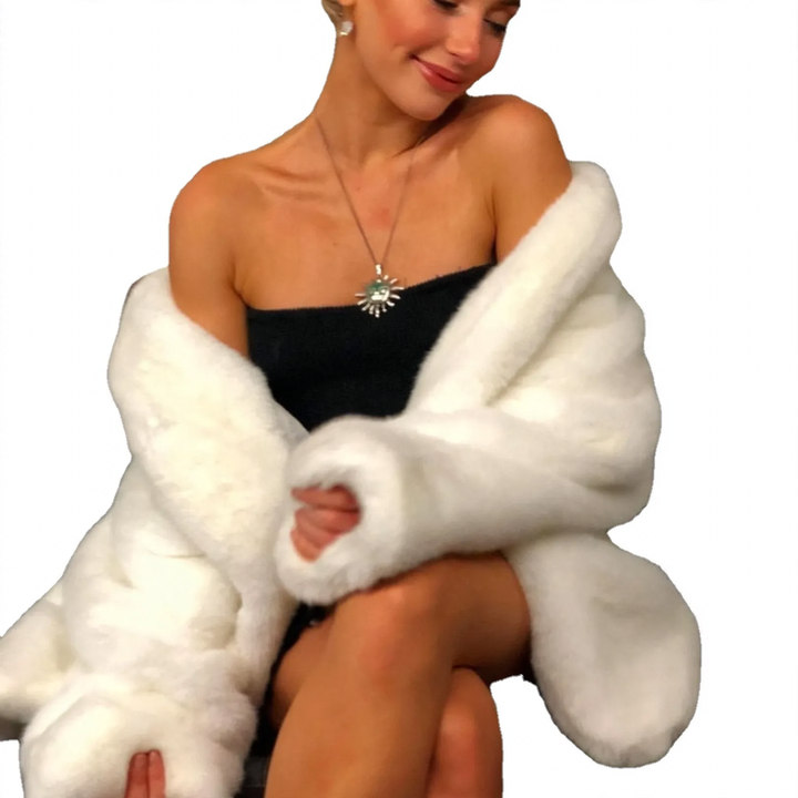 Elegant women's faux fur coat, fluffy