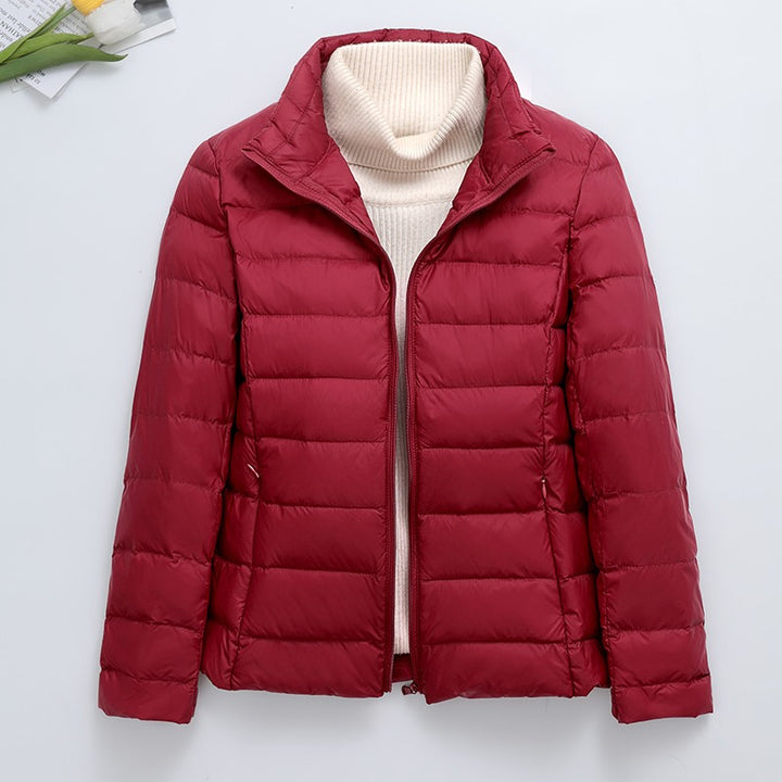 Light women's quilted jacket, short, with hood