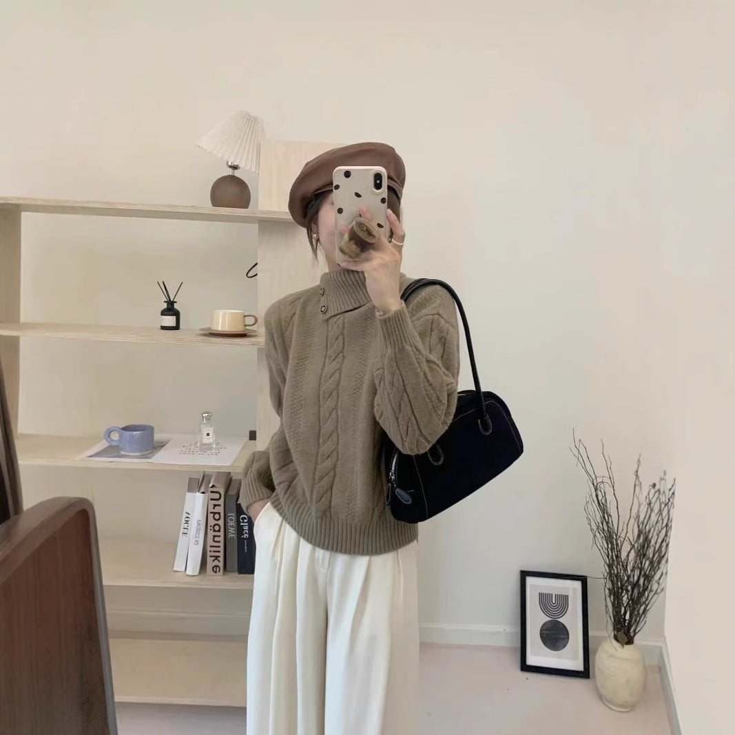 Short cable knit sweater with asymmetric neckline