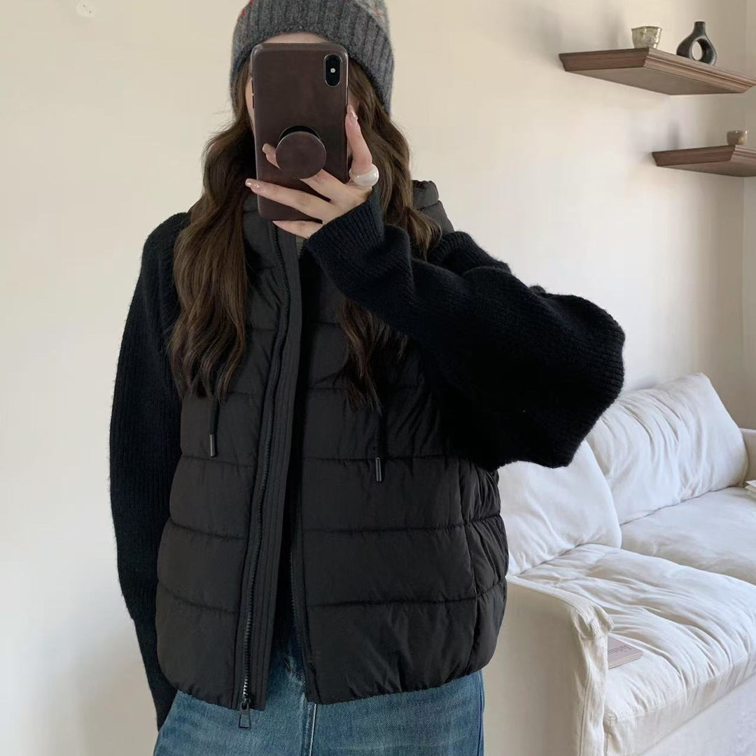 Short ladies' padded jacket with knitted sleeves and hood