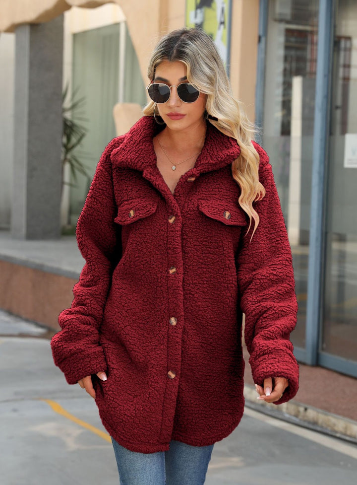 Long women's coat made of soft plush with notched collar