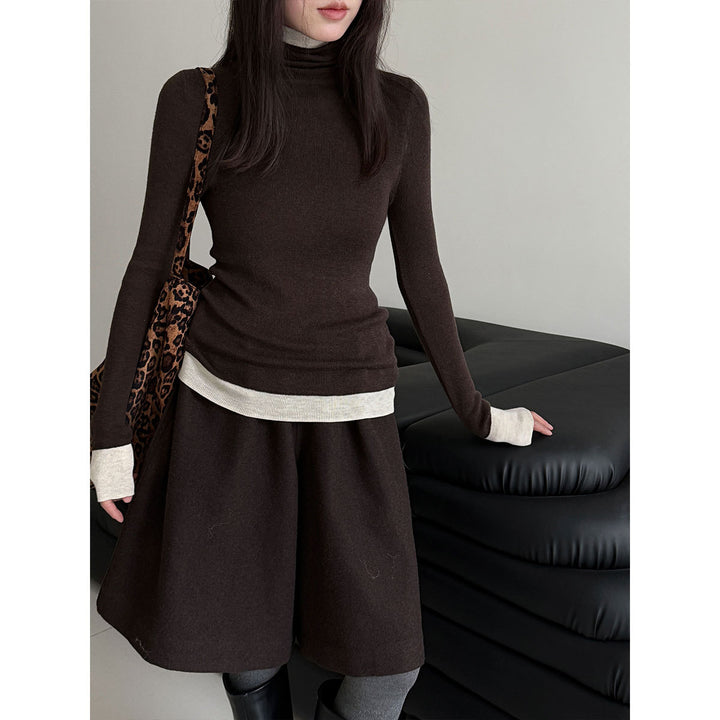 Women's knit pullover with stand-up collar and contrast details