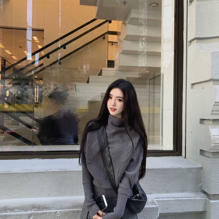 Women's knit sweater with turtleneck and bat sleeves