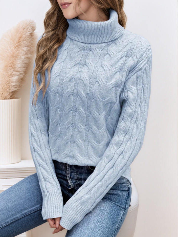 Knit sweater with cable pattern and high collar