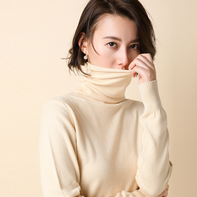 Women's knitted pullover with stand collar and geometric pattern