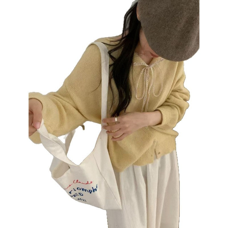 Ladies' cardigan with lace collar and tie string
