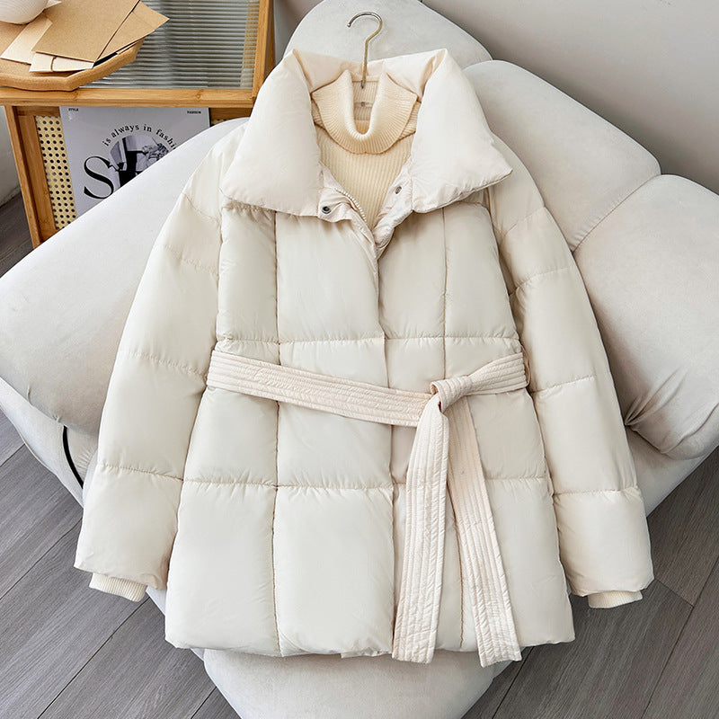 Mid-length women's winter jacket with waist belt