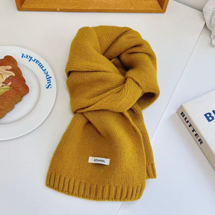 Simple knitted scarf made of pure wool