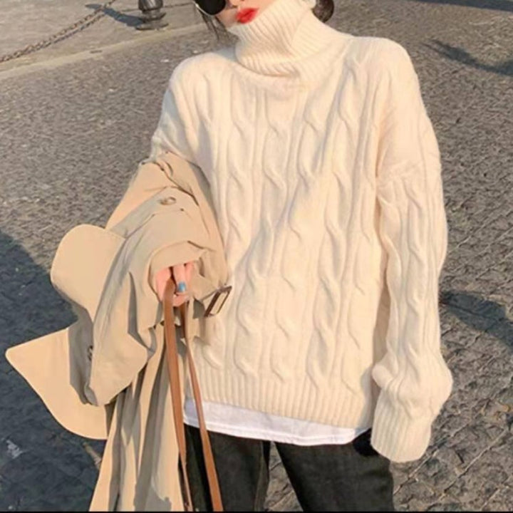 Women’s knit sweater with cable pattern and roll neck