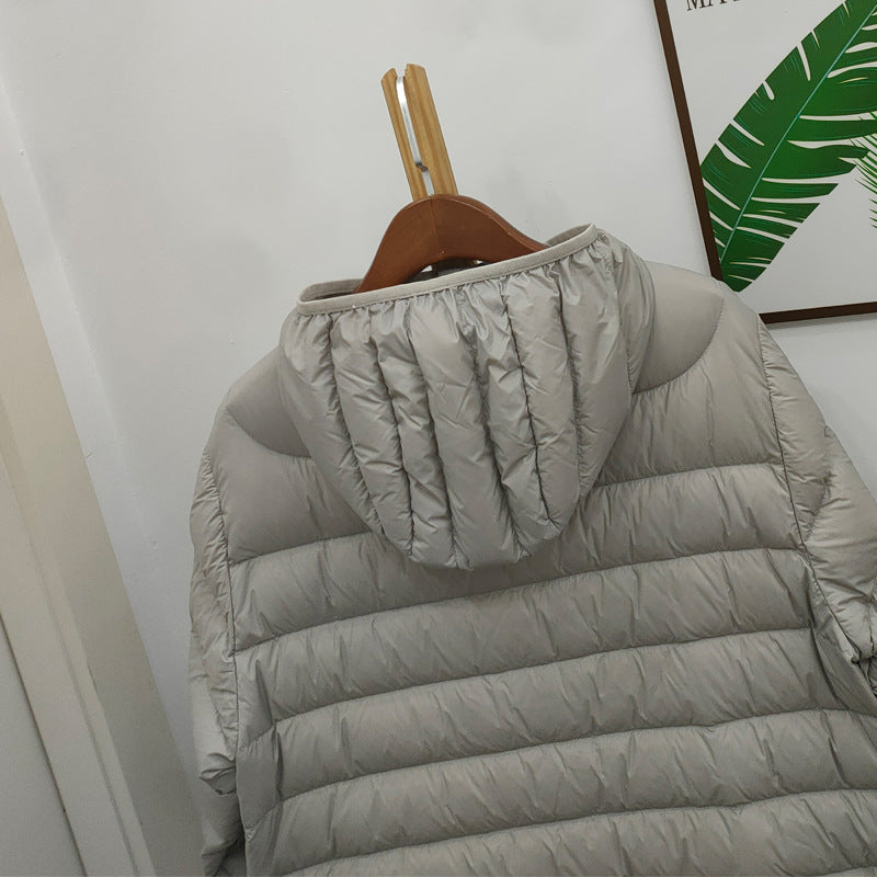 Light women's down jacket with hood, quilted