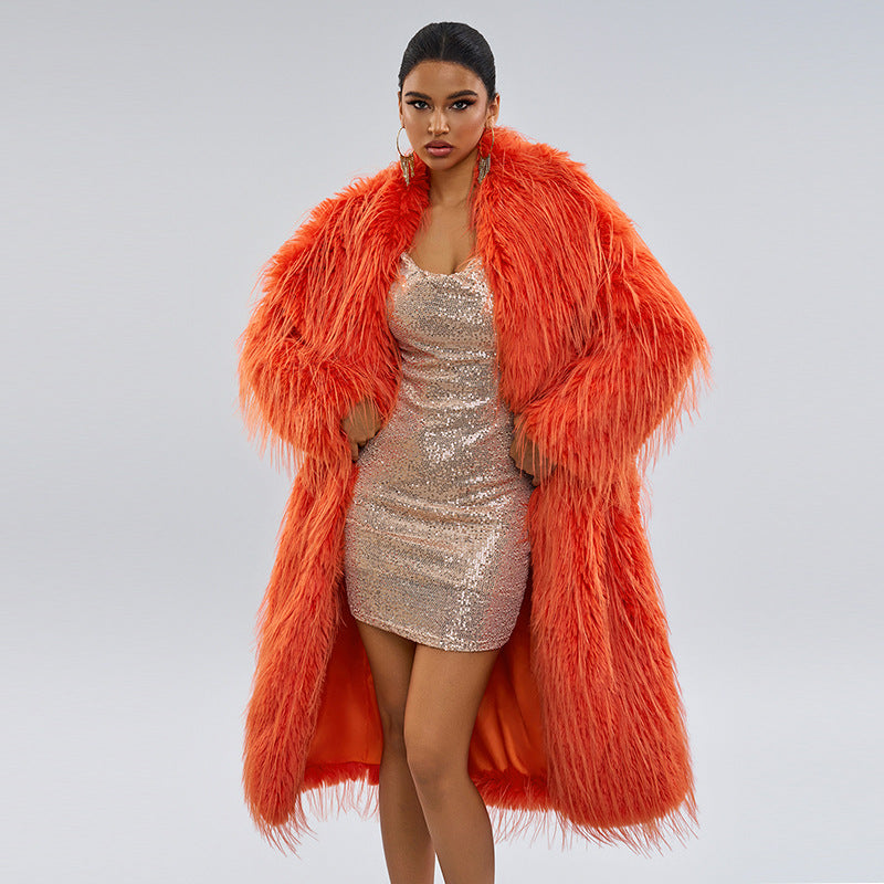 Long women’s faux fur coat with fringes