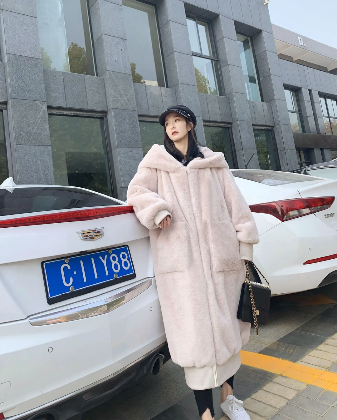 Long ladies' hooded jacket in rabbit fur look