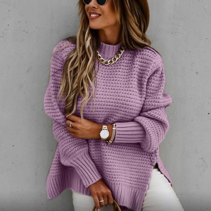 Loose women's knit sweater with cable pattern