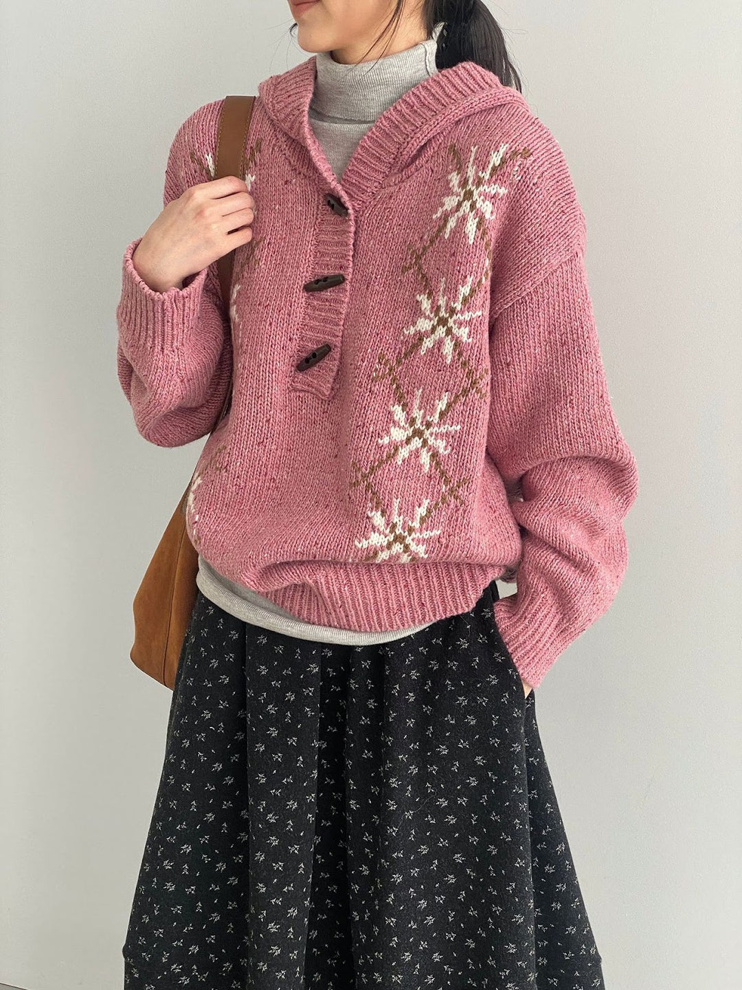 Hooded pullover with snowflake pattern, knitted