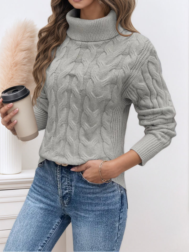 Knit sweater with cable pattern and high collar
