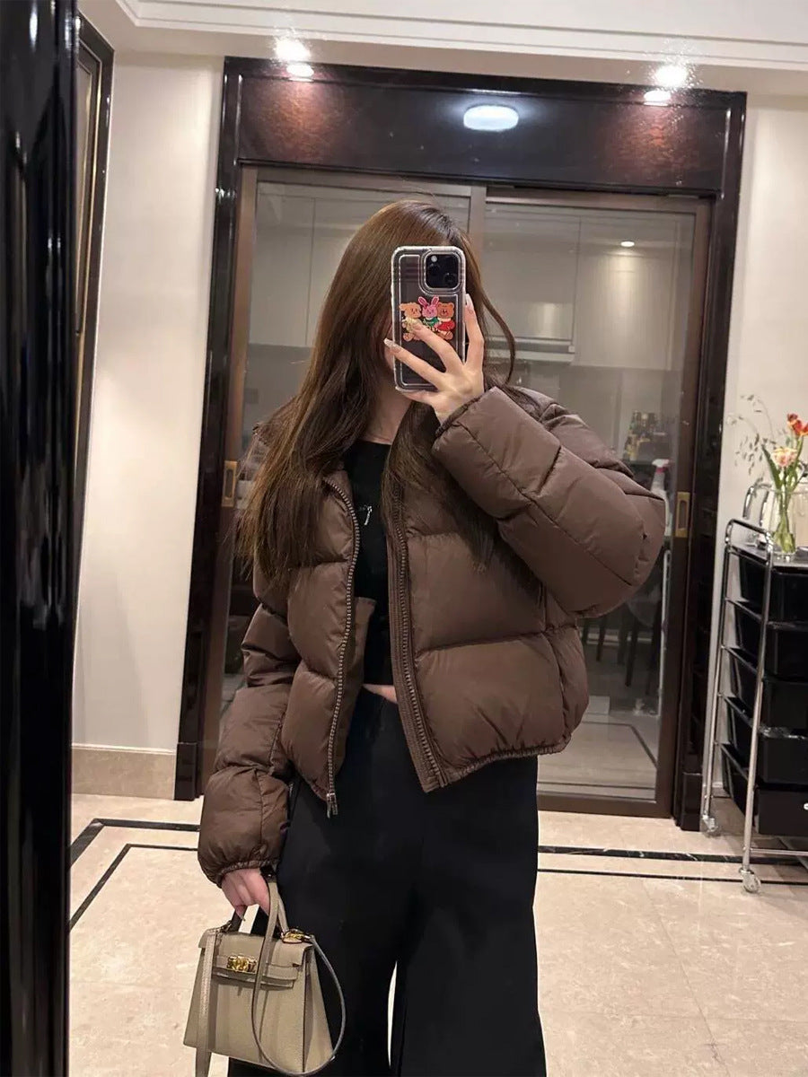 Short, padded women's winter jacket in puffer style