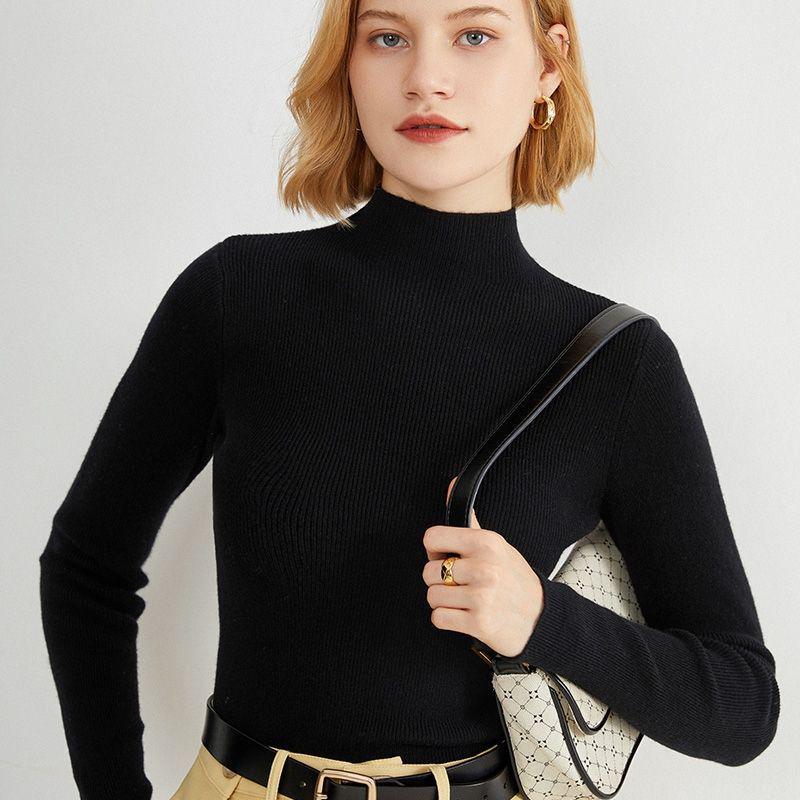 Women's knitted pullover with stand-up collar, fitted