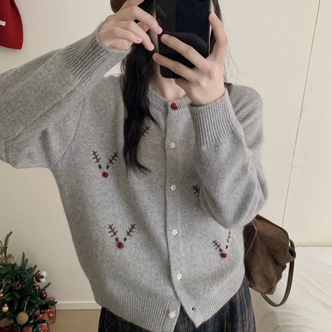 Festive knitted sweater with reindeer embroidery