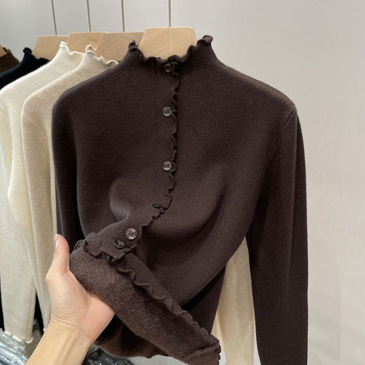 Women's pullover with stand-up collar and wave hem