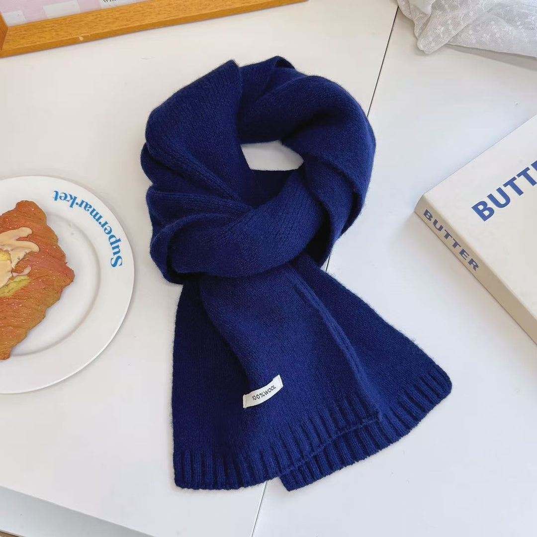 Simple knitted scarf made of pure wool
