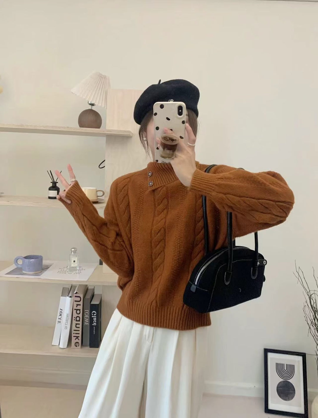 Short cable knit sweater with asymmetric neckline