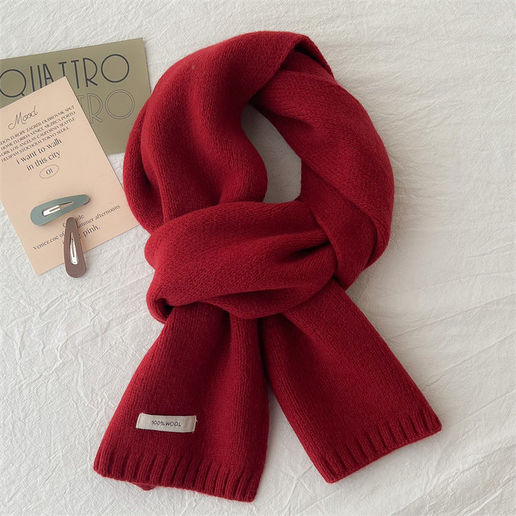 Simple knitted scarf made of pure wool