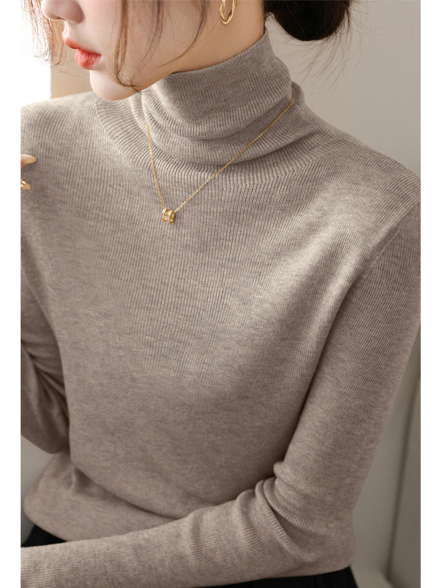 Women's knitted sweater, fitted, with stand-up collar