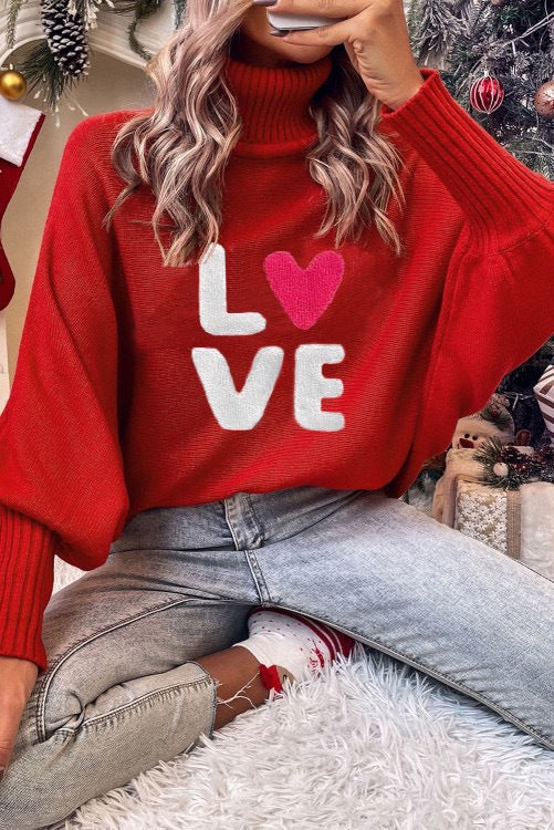 Women's knitted pullover with stand-up collar and embroidery