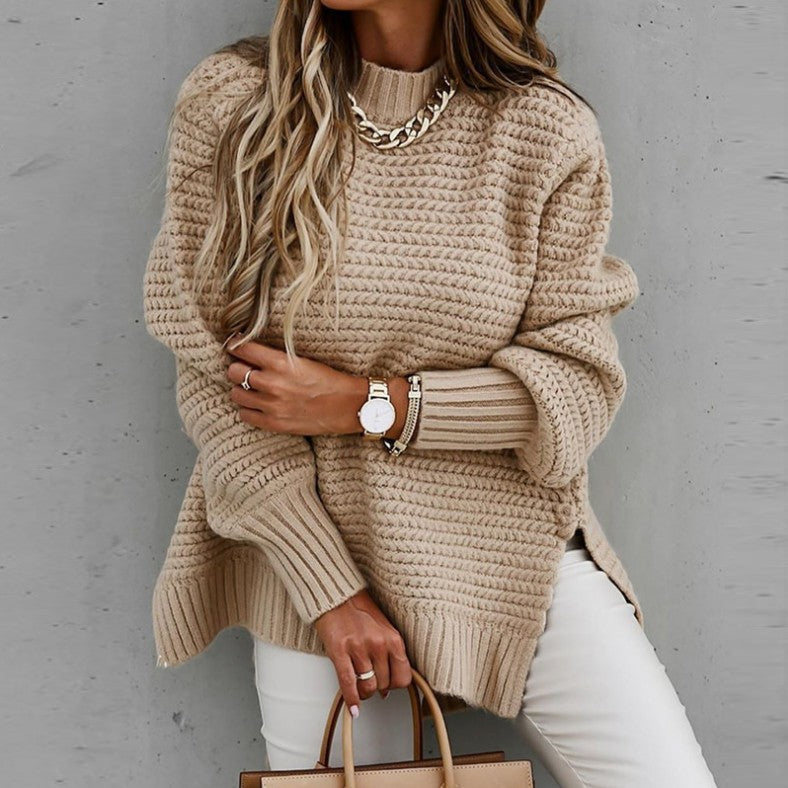 Loose women's knit sweater with cable pattern