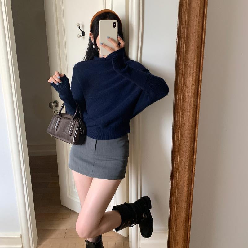 Women's knit sweater with turtleneck and bat sleeves