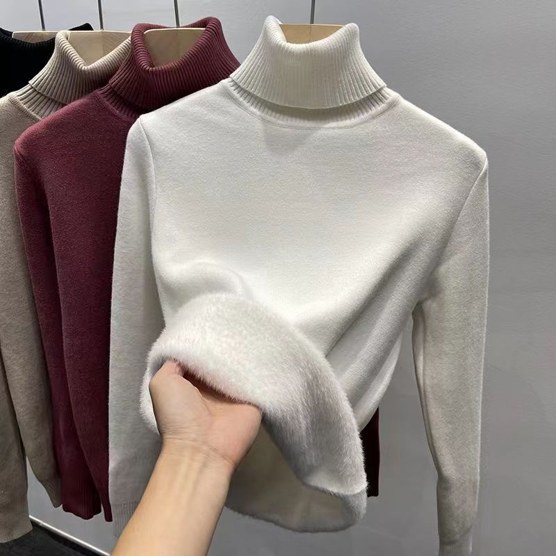 Padded women's knit sweater with high collar