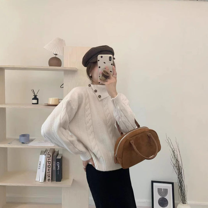 Short cable knit sweater with asymmetric neckline